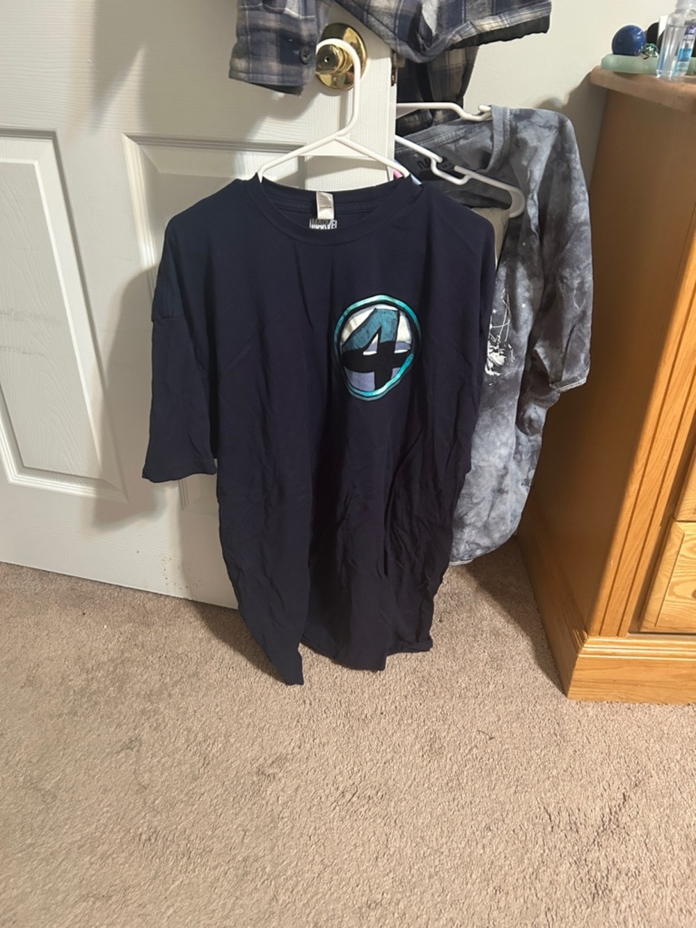 Marvel Navy Tee with Teal and Light Blue Emblem